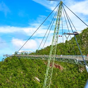 Popular tourist attraction. Bridge over the abyss on one pillar. Langkawi, Malaysia - 07.08.2020